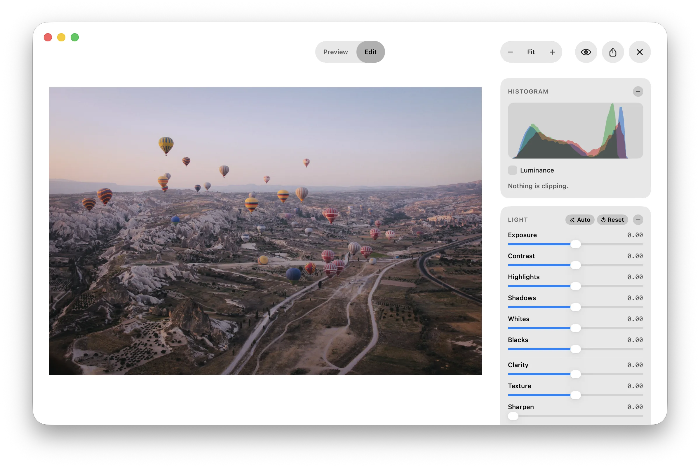 The Luz Photo editor — a photograph on the canvas beside panels for tools, histogram, insights, snapshots, styles, and light adjustments.
